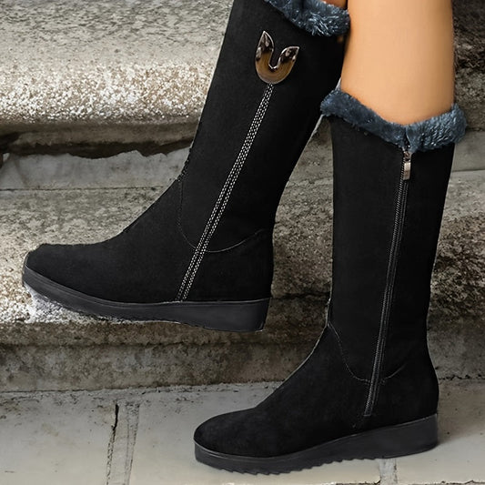Black knee-high boots with fur lining worn by a person on stone steps